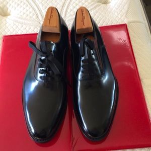 Brand New Salvatore Ferragamo black leather plain toe oxfords. Size 11